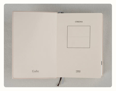 CRENA multi-year journal open to the title page and inside cover