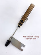 Metal maintenance wrench beside the extended filling rod of a 699 vacuum-filling fountain pen