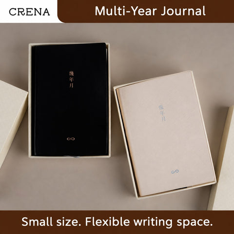 CRENA multi-year journals in black and cream covers displayed in presentation boxes