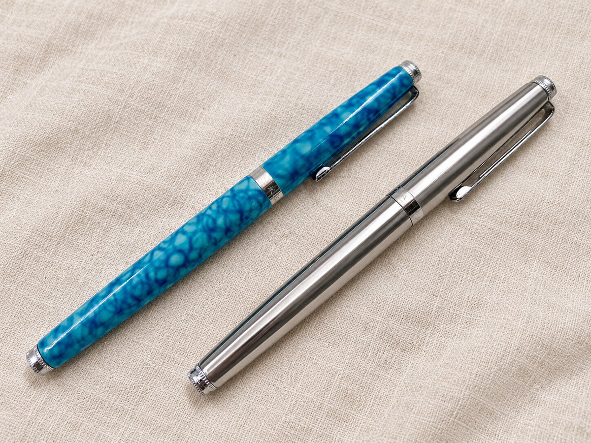Wing Sung 500 vintage fountain pens in blue marbled acrylic and stainless steel, shown capped