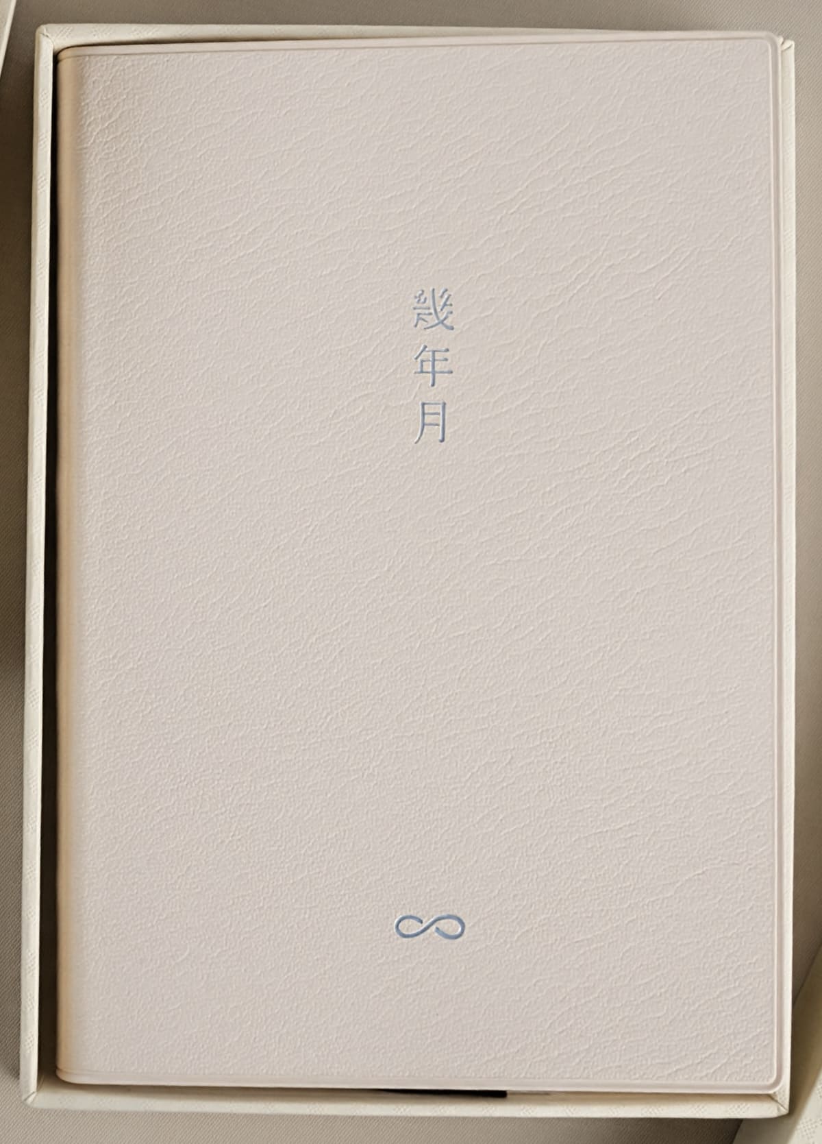 Cream CRENA multi-year journal with foil-stamped cover lettering in its presentation box