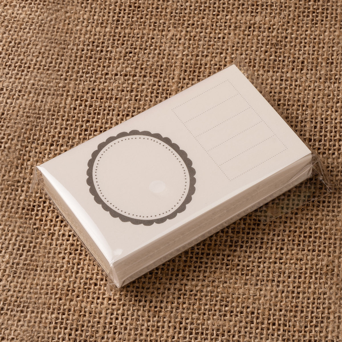 CRENA ink swatch cards with a scalloped circular frame and ruled information fields