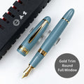 Lake-blue Wing Sung 629 fountain pen with gold-tone trim, rounded ends, and a full ink window