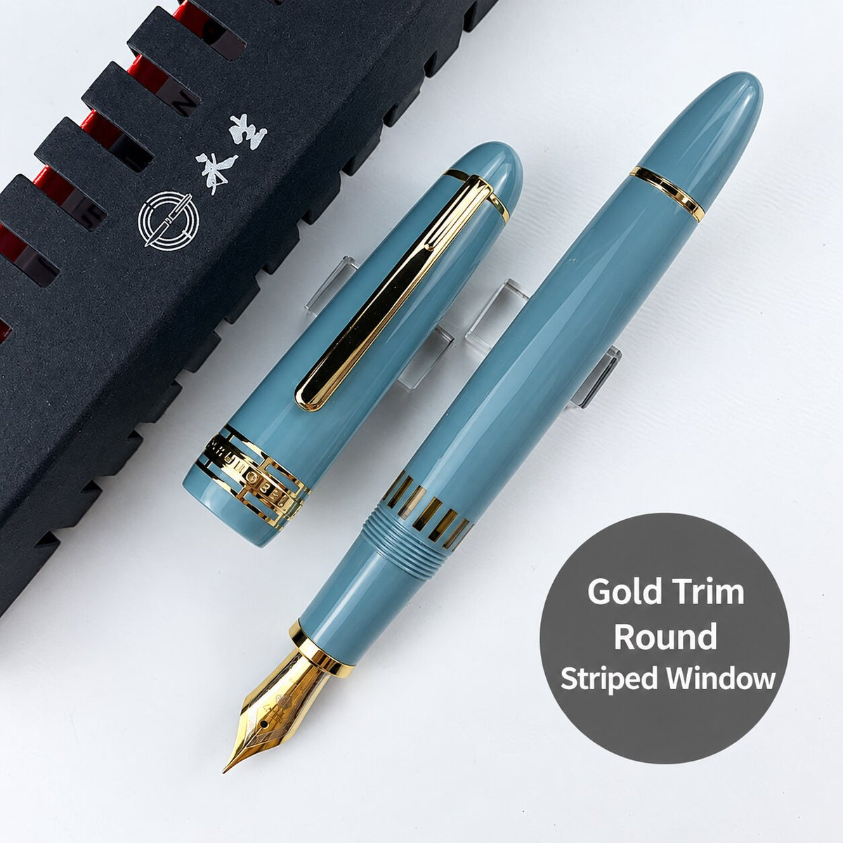 Lake-blue Wing Sung 629 fountain pen with gold-tone trim, rounded ends, and a striped ink window