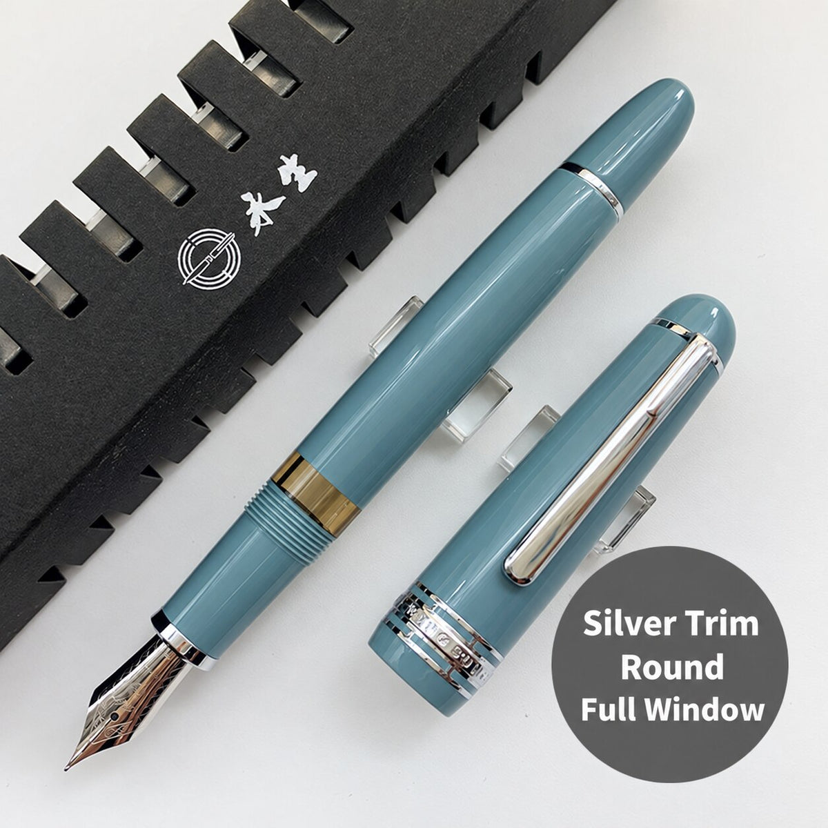 Lake-blue Wing Sung 629 fountain pen with silver-tone trim, rounded ends, and a full ink window