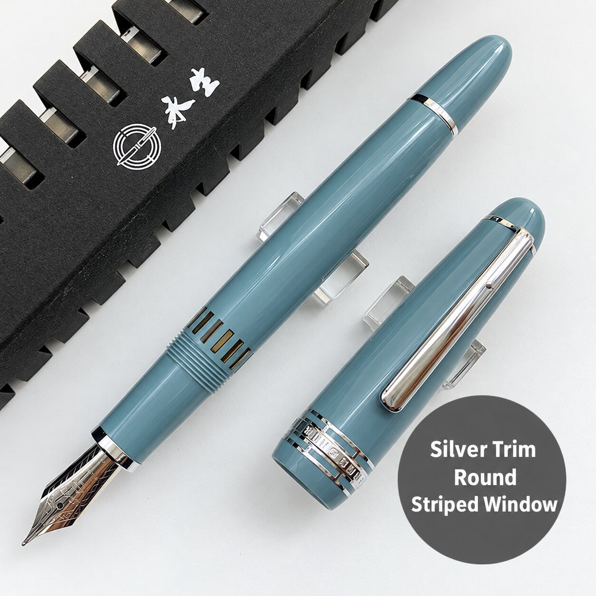 Lake-blue Wing Sung 629 fountain pen with silver-tone trim, rounded ends, and a striped ink window